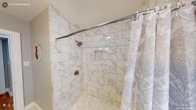 bathroom with a shower with curtain