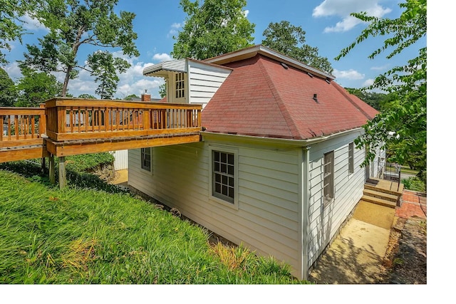 back of property featuring a deck