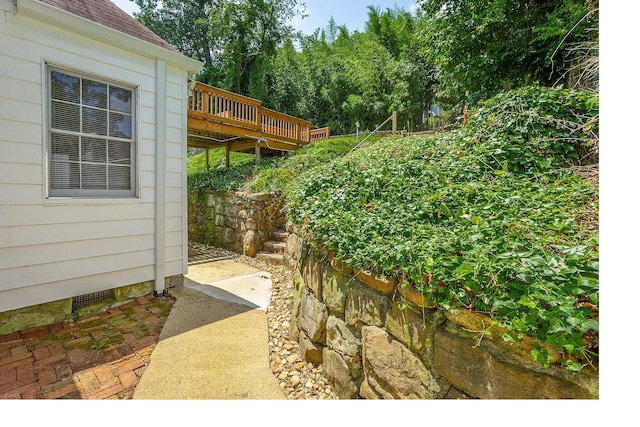 view of yard with a wooden deck