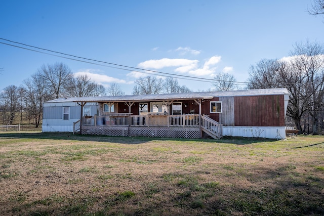 view of front of home with covered porch and a front yard