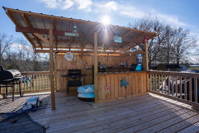 wooden deck with grilling area