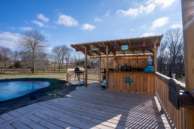 wooden deck with a covered pool