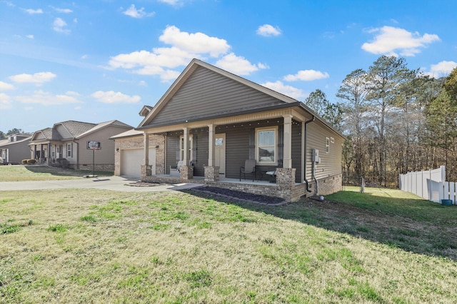 view of front of house featuring covered porch, a front yard, fence, a garage, and driveway