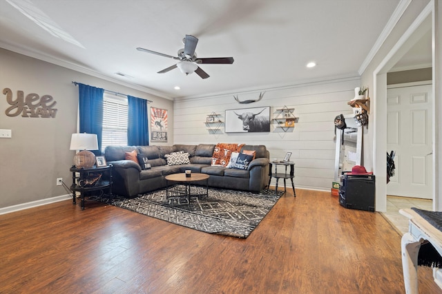 living room featuring ornamental molding, visible vents, and wood finished floors