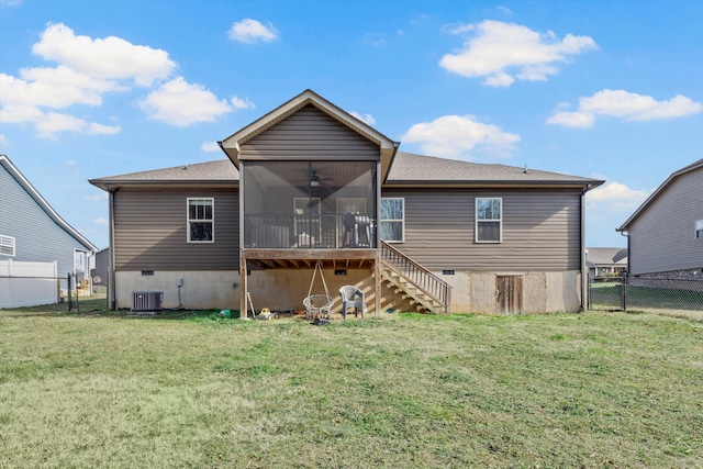 rear view of property featuring stairs, a lawn, a gate, and a sunroom