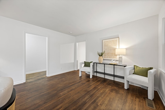 sitting room with dark hardwood / wood-style floors