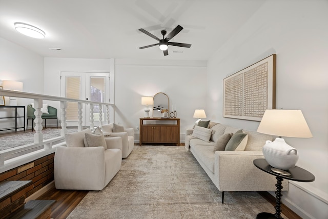 living room with ceiling fan, french doors, and hardwood / wood-style flooring