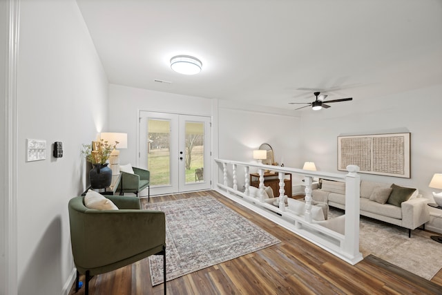 living room with ceiling fan, french doors, and wood-type flooring