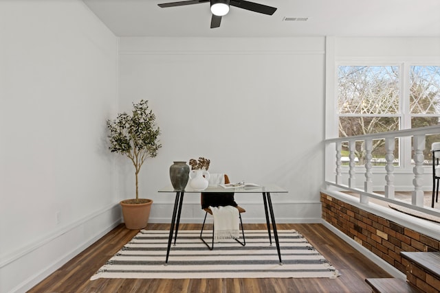 office area featuring dark hardwood / wood-style floors and ceiling fan