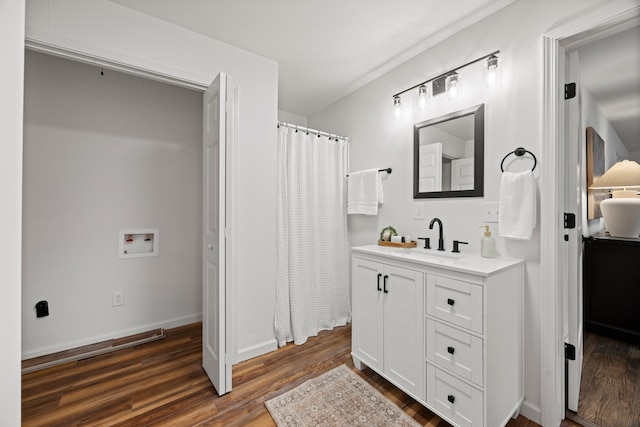 bathroom featuring vanity and hardwood / wood-style flooring