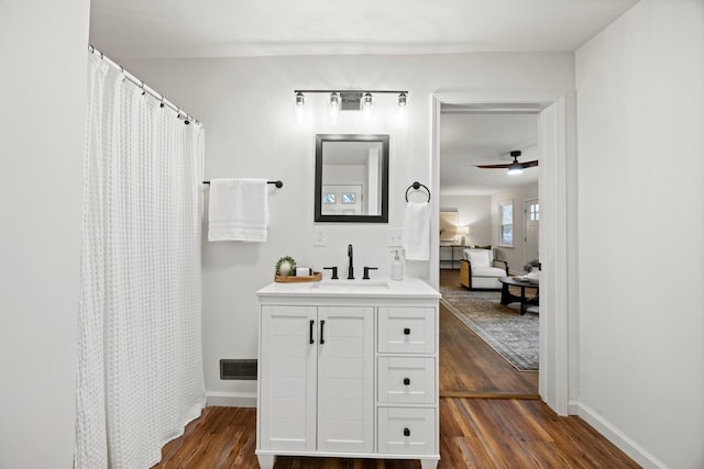 bathroom featuring vanity, hardwood / wood-style flooring, and ceiling fan