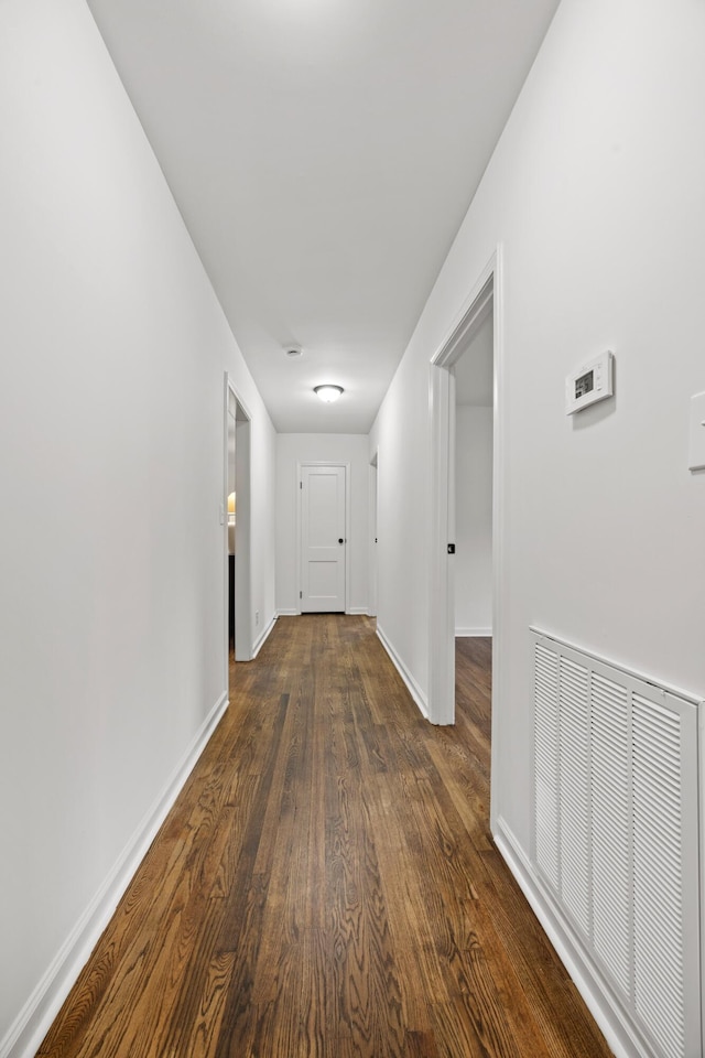 hall featuring dark wood-type flooring