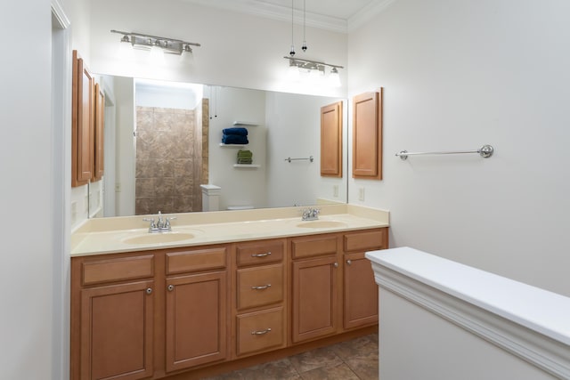 bathroom with toilet, tile patterned floors, a shower, vanity, and crown molding