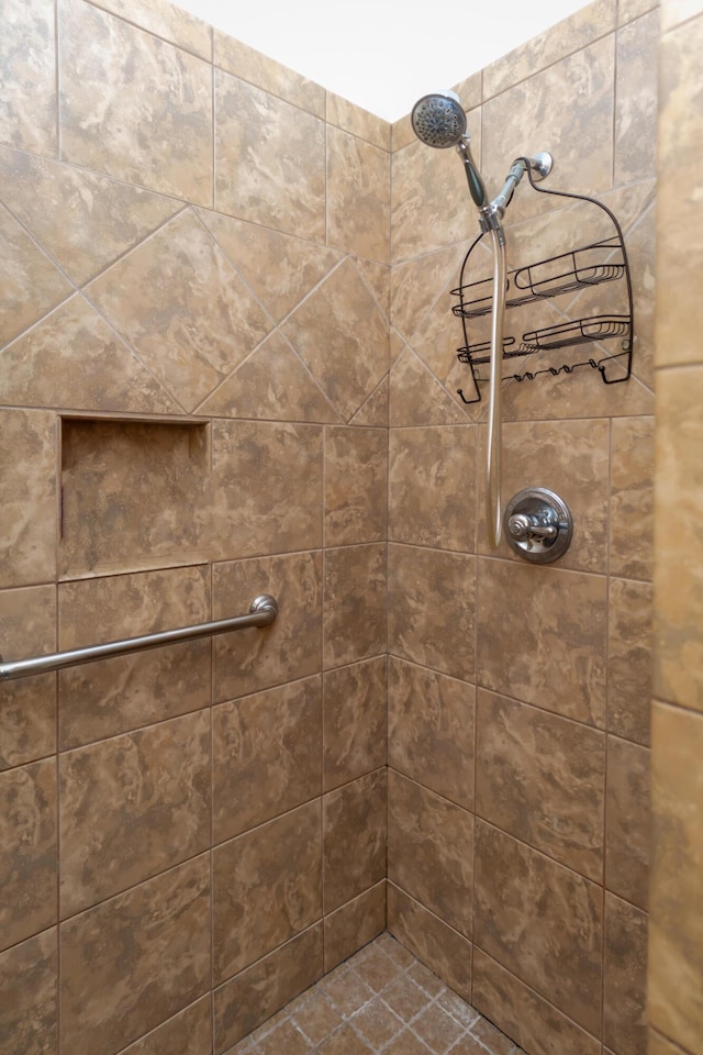 bathroom with tiled shower