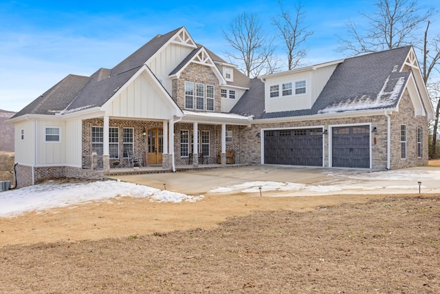 view of front of property featuring covered porch and a garage