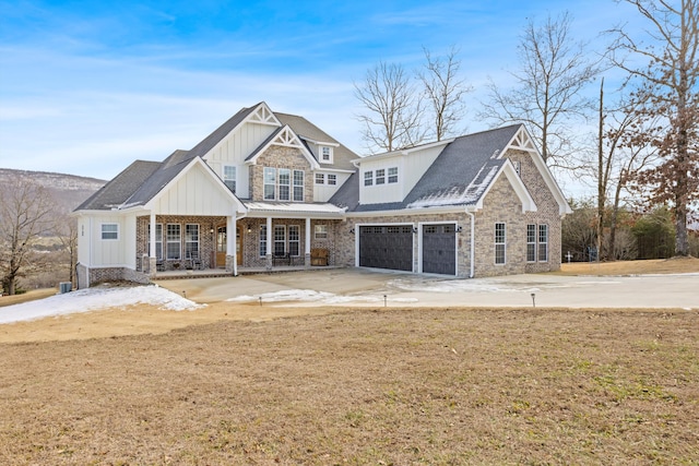 craftsman house with a front yard and a porch