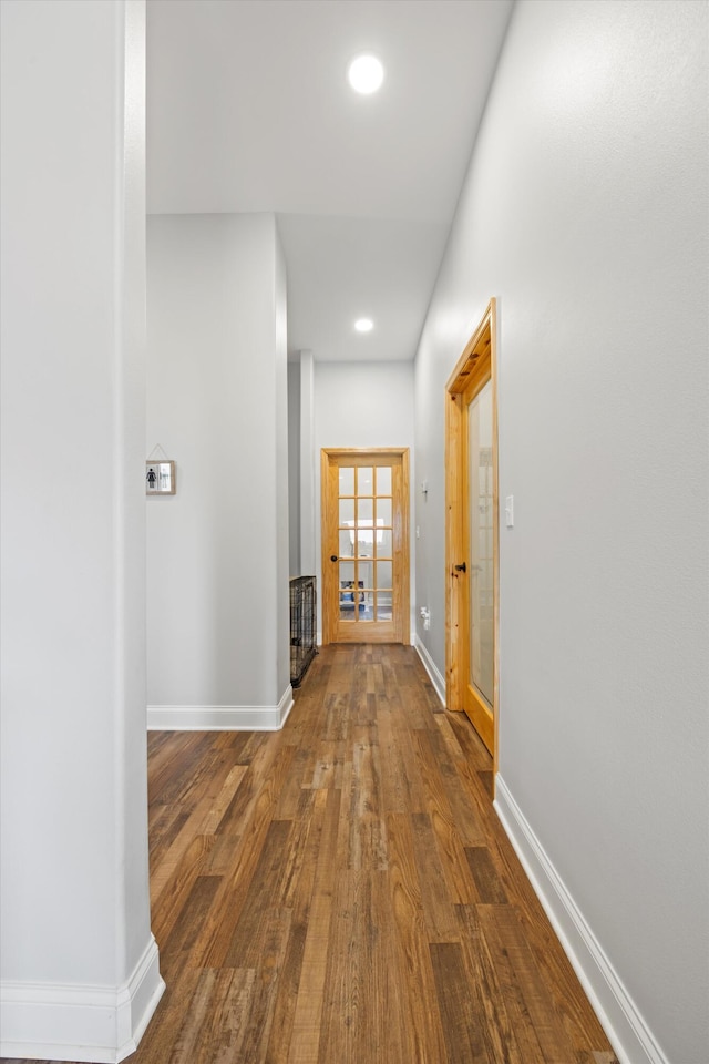 corridor featuring wood-type flooring