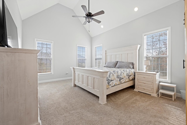 bedroom with ceiling fan, light colored carpet, and high vaulted ceiling