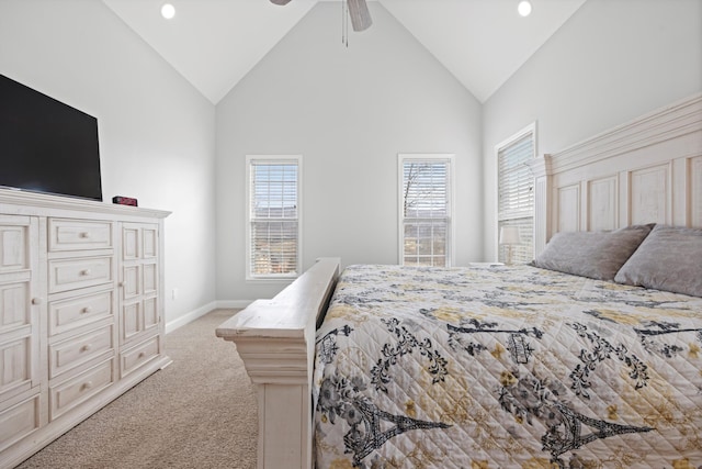 bedroom with light carpet, ceiling fan, and high vaulted ceiling