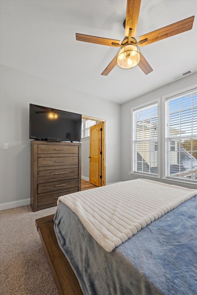 carpeted bedroom featuring ceiling fan