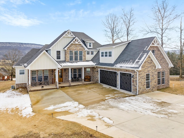 craftsman inspired home featuring a porch and a garage