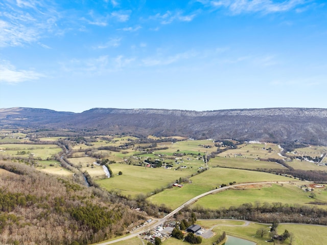 drone / aerial view with a rural view and a water and mountain view