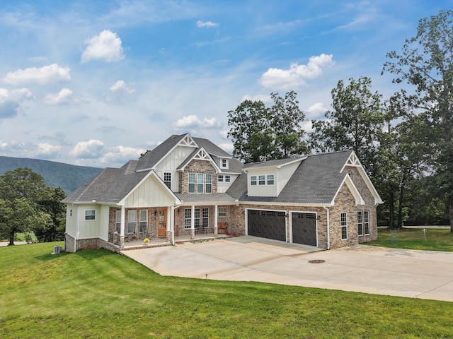 300 Skyhigh Dr, Dunlap, TN 37327 - view of front facade featuring board and batten siding, stone siding, concrete driveway, a front yard, and a porch