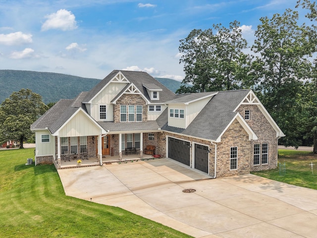 300 Skyhigh Dr, Dunlap, TN 37327 - view of front of property featuring board and batten siding, a porch, stone siding, and a front lawn