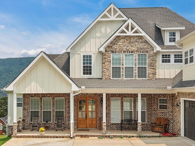 300 Skyhigh Dr, Dunlap, TN 37327 - view of front facade featuring board and batten siding, a porch, roof with shingles, and stone siding