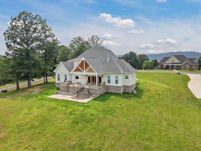 300 Skyhigh Dr, Dunlap, TN 37327 - rear view of property featuring board and batten siding, a patio area, a lawn, a shingled roof, and stone siding