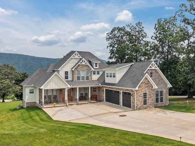 300 Skyhigh Dr, Dunlap, TN 37327 - craftsman-style house with board and batten siding, stone siding, covered porch, a front yard, and concrete driveway