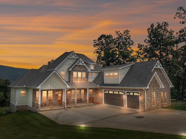 300 Skyhigh Dr, Dunlap, TN 37327 - view of front of house with covered porch, stone siding, board and batten siding, concrete driveway, and an attached garage