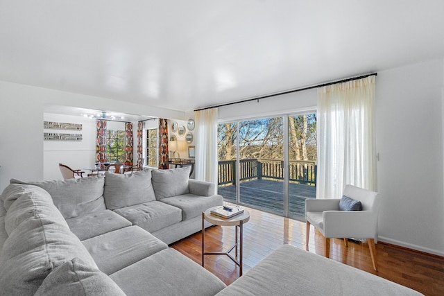 living area with hardwood / wood-style floors and baseboards