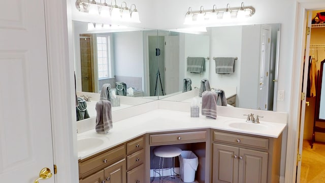 bathroom featuring vanity and an enclosed shower