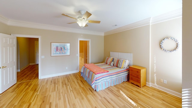 bedroom with ceiling fan, crown molding, and hardwood / wood-style flooring