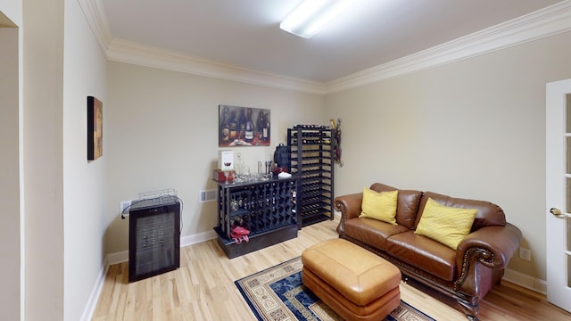 living room with wood-type flooring and crown molding