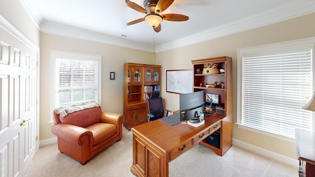 office space with ceiling fan, ornamental molding, and light carpet