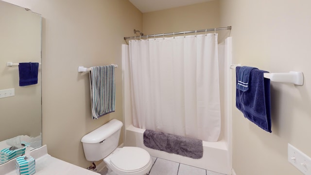 bathroom featuring tile patterned flooring, shower / bath combination with curtain, and toilet