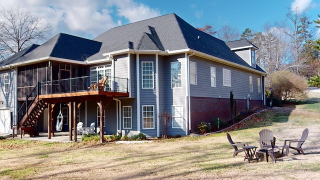 exterior space featuring a patio, a fire pit, and a deck