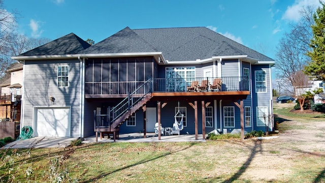 back of property featuring a sunroom, a patio area, a garage, and a yard