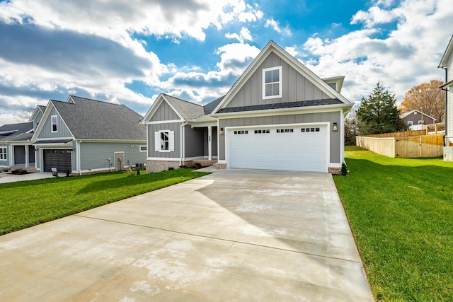 craftsman inspired home featuring a front yard and a garage