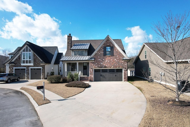 view of front of property featuring covered porch and a garage