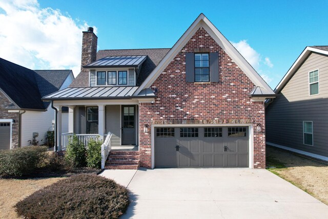 view of front of home with a garage and a porch