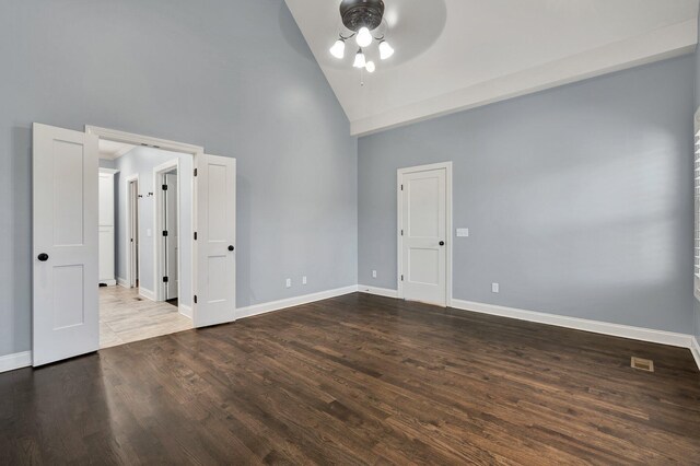 spare room featuring ceiling fan, hardwood / wood-style floors, and high vaulted ceiling