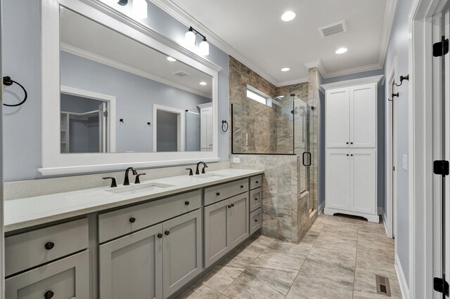 bathroom featuring walk in shower, vanity, and ornamental molding