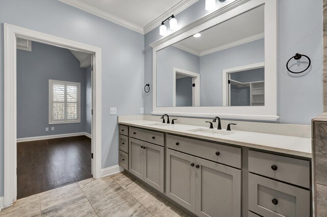 bathroom featuring vanity and crown molding