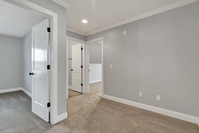 empty room with light carpet and ornamental molding