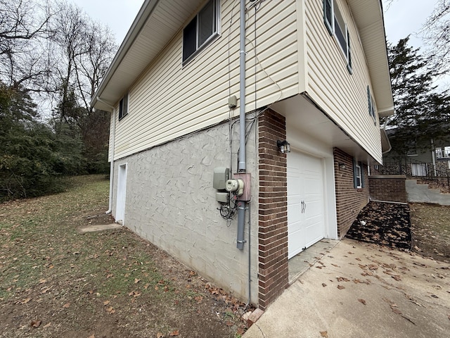 view of side of property with a garage