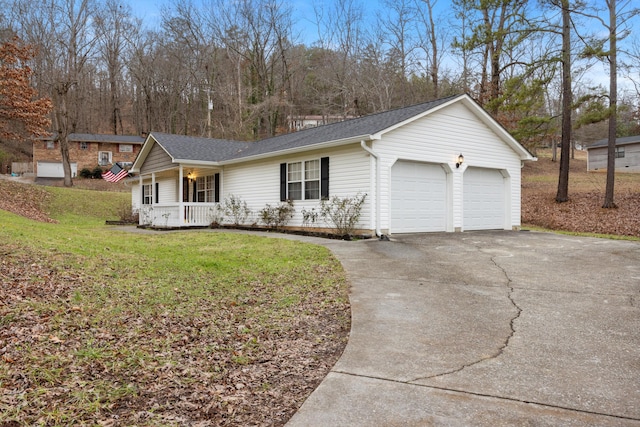 ranch-style home featuring a garage, covered porch, and a front lawn