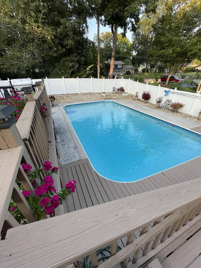 view of pool with a wooden deck